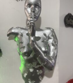 Silver Face with Finger to Lips Statue
