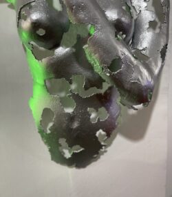 Silver Face with Finger to Lips Statue