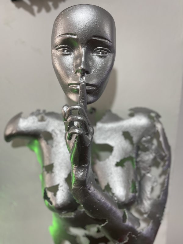 Silver Face with Finger to Lips Statue