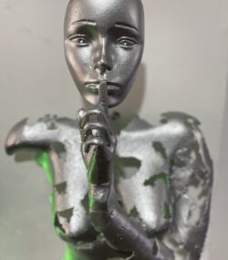Silver Face with Finger to Lips Statue