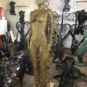 Handcrafted Golden standing woman. axle nuts female statue