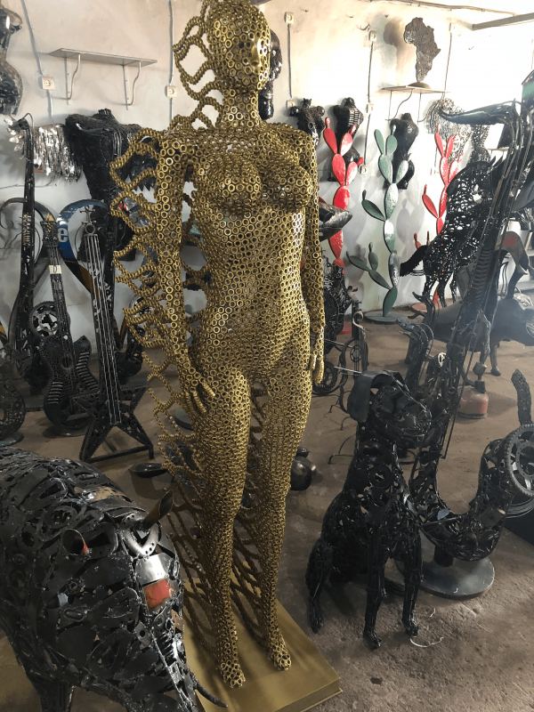 Handcrafted Golden standing woman. axle nuts female statue