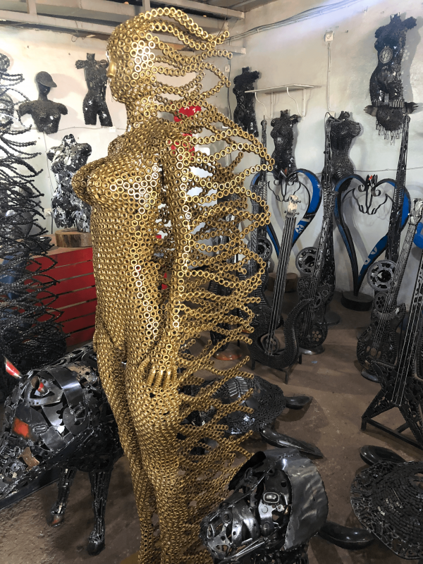Handcrafted Golden standing woman. axle nuts female statue