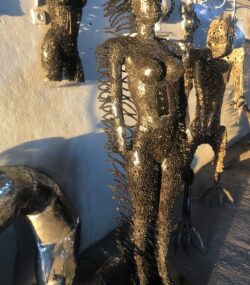 Handcrafted black standing woman metal bust female