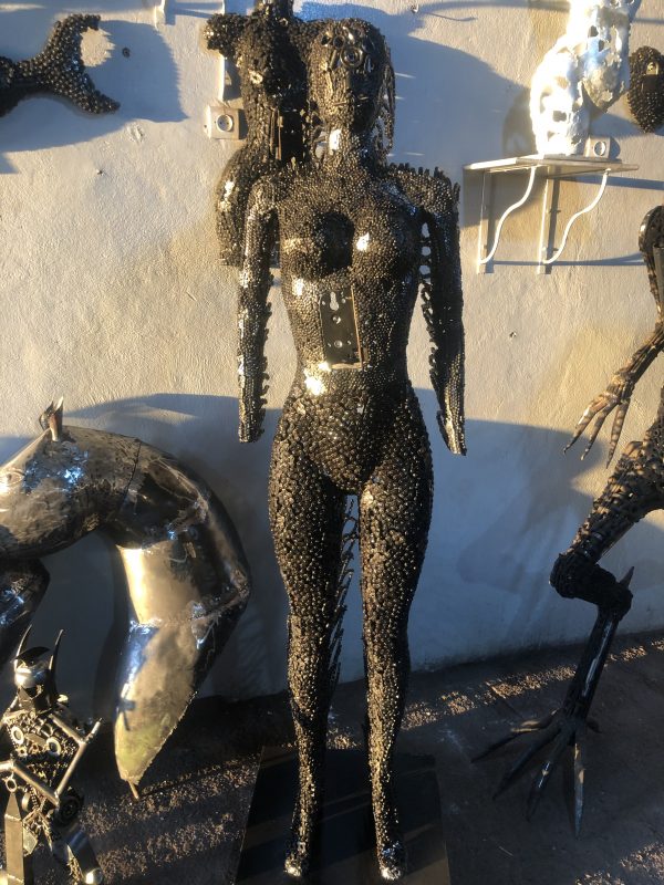 Handcrafted black standing woman metal bust female