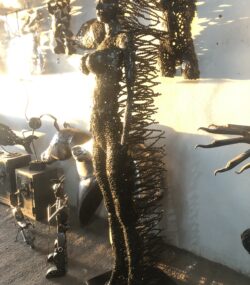 Handcrafted black standing woman metal bust female
