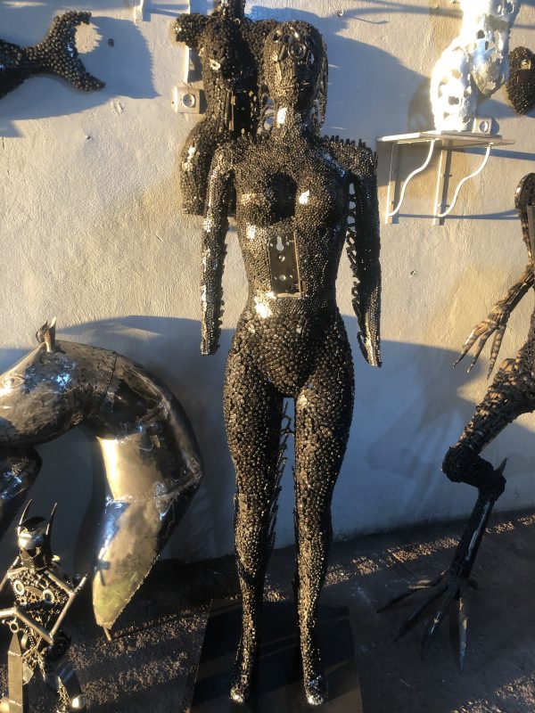 Handcrafted black standing woman metal bust female