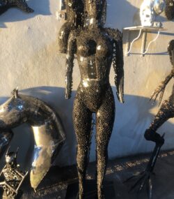 Handcrafted black standing woman metal bust female