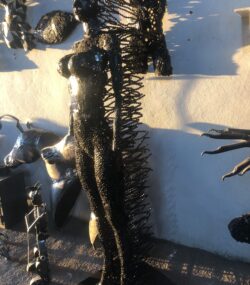 Handcrafted black standing woman metal bust female